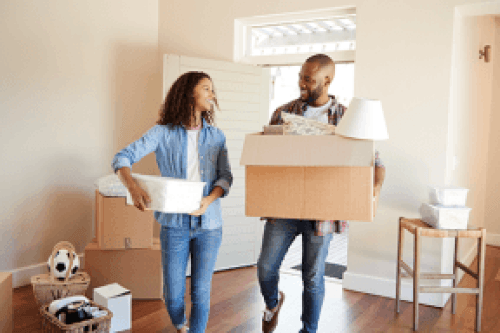 Couple shipping small furniture in boxes