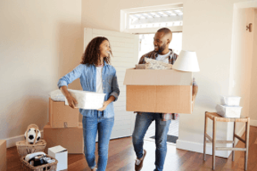 Couple in House packing boxes for shipment