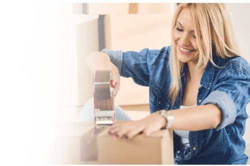 Woman taping a box