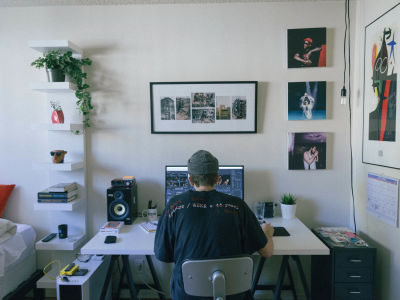 man working on desktop at home