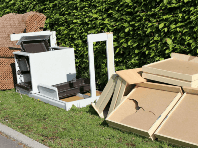 stack of items on the side of the road