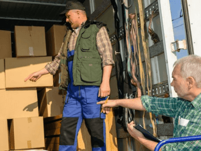 two movers packing a truck
