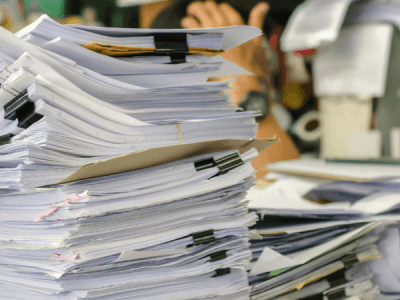 stacks of papers on a desk