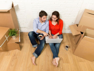 couple siting with boxes