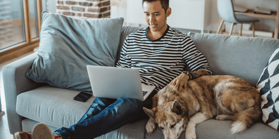 man with dog on couch