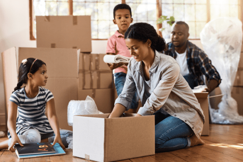 Family unboxing boxes from a move