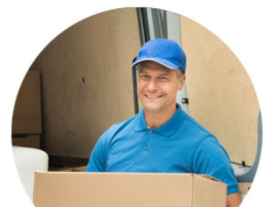Man in uniform moving packed shipped box